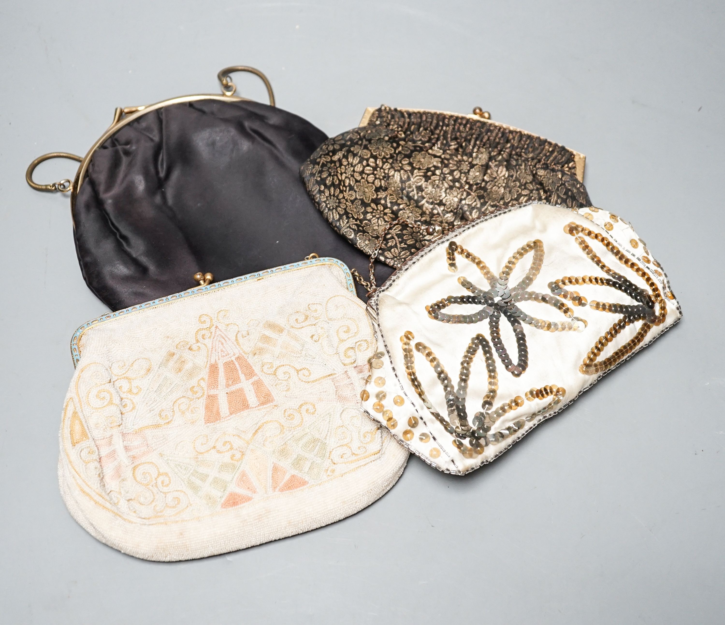 A beaded and embroidered evening bag, a similar sequinned bag and two others